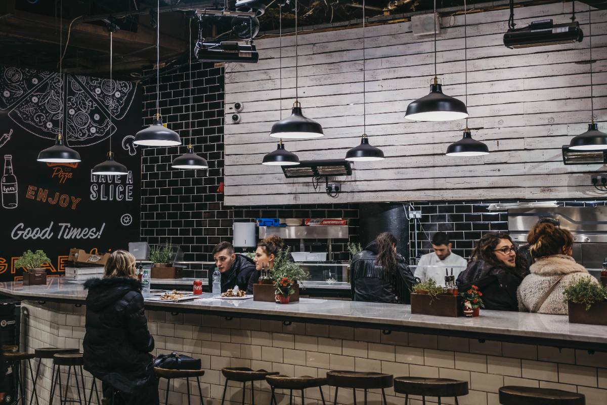 Photo: guests dining at the counter during evening service