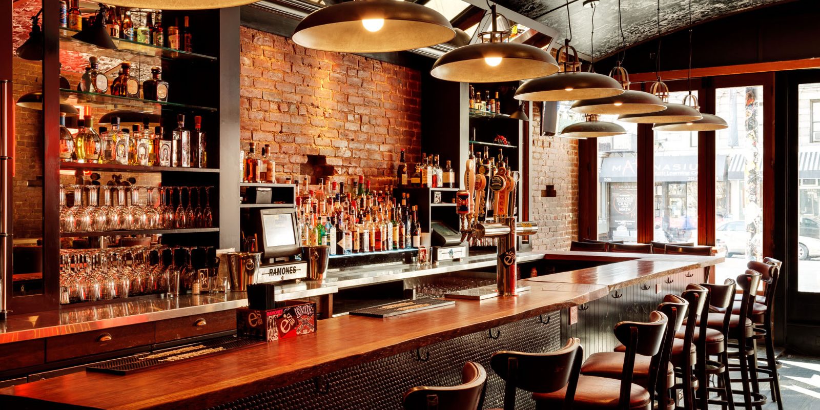 Photo: a warmly lit neighborhood bar and restaurant interior