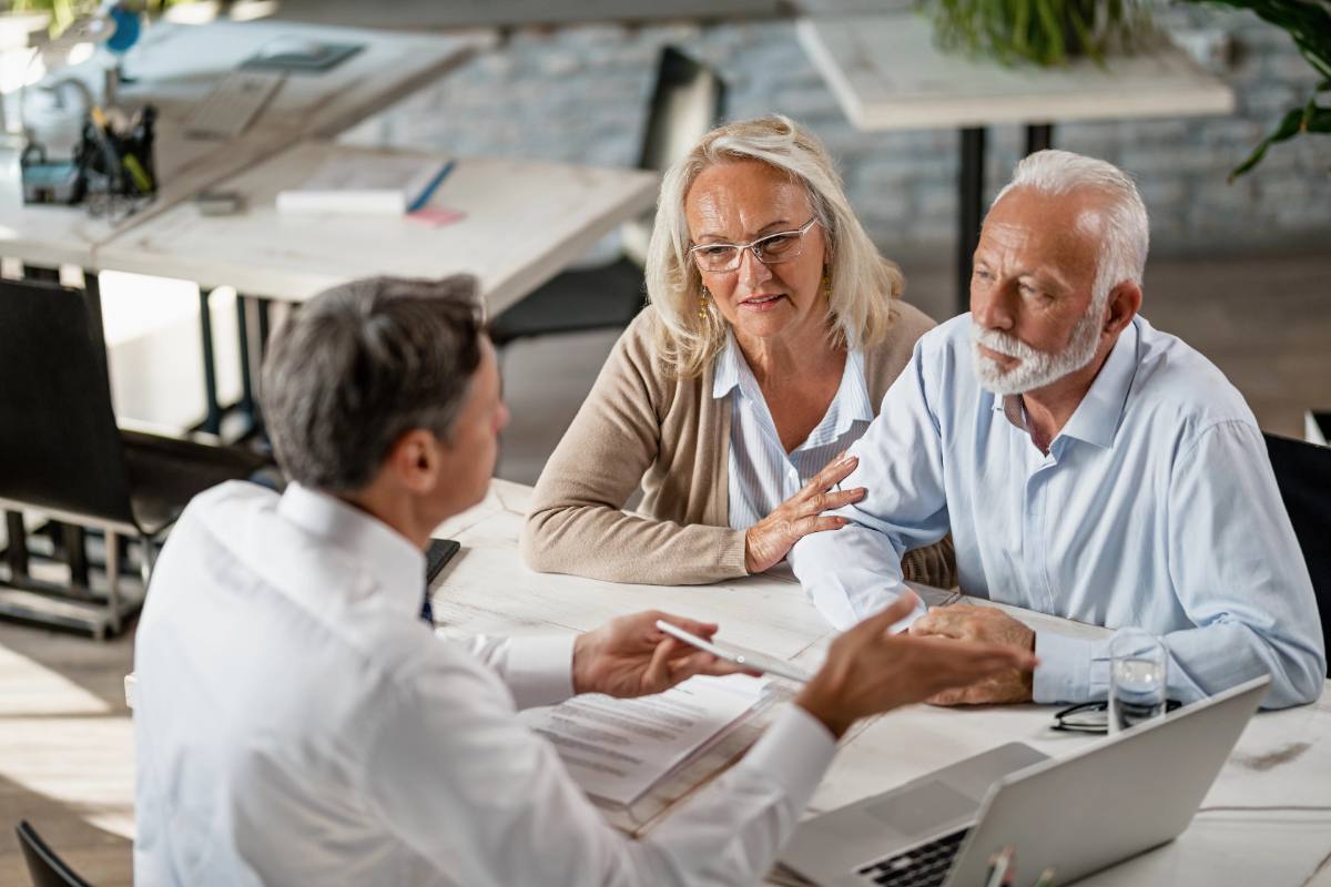 Photo: an advisor discussing coverage with a couple