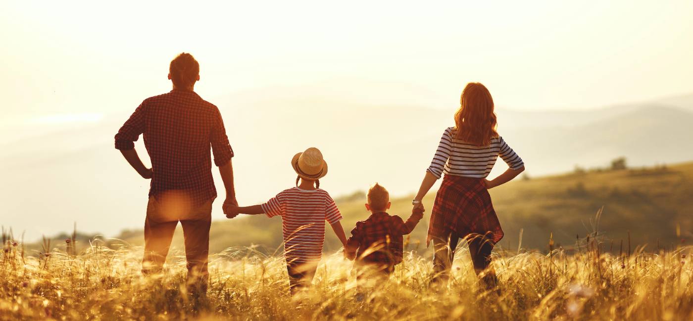 Photo: a family talking through a life insurance plan with their advisor